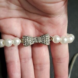 Faux pearl bracelet with rhinestone bow